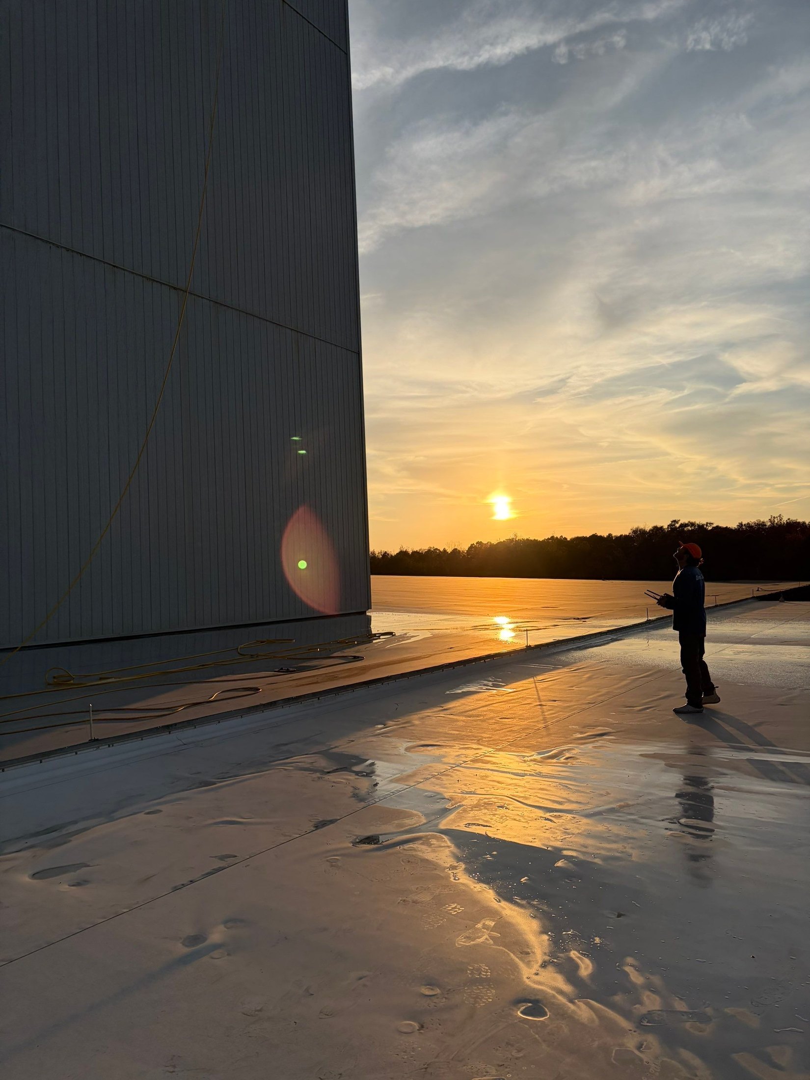 Operator controlling commercial drone cleaning equipment